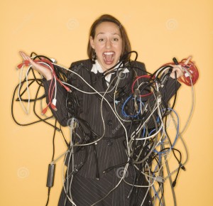 http://www.dreamstime.com/royalty-free-stock-photos-woman-holding-tangled-wires-image2425918